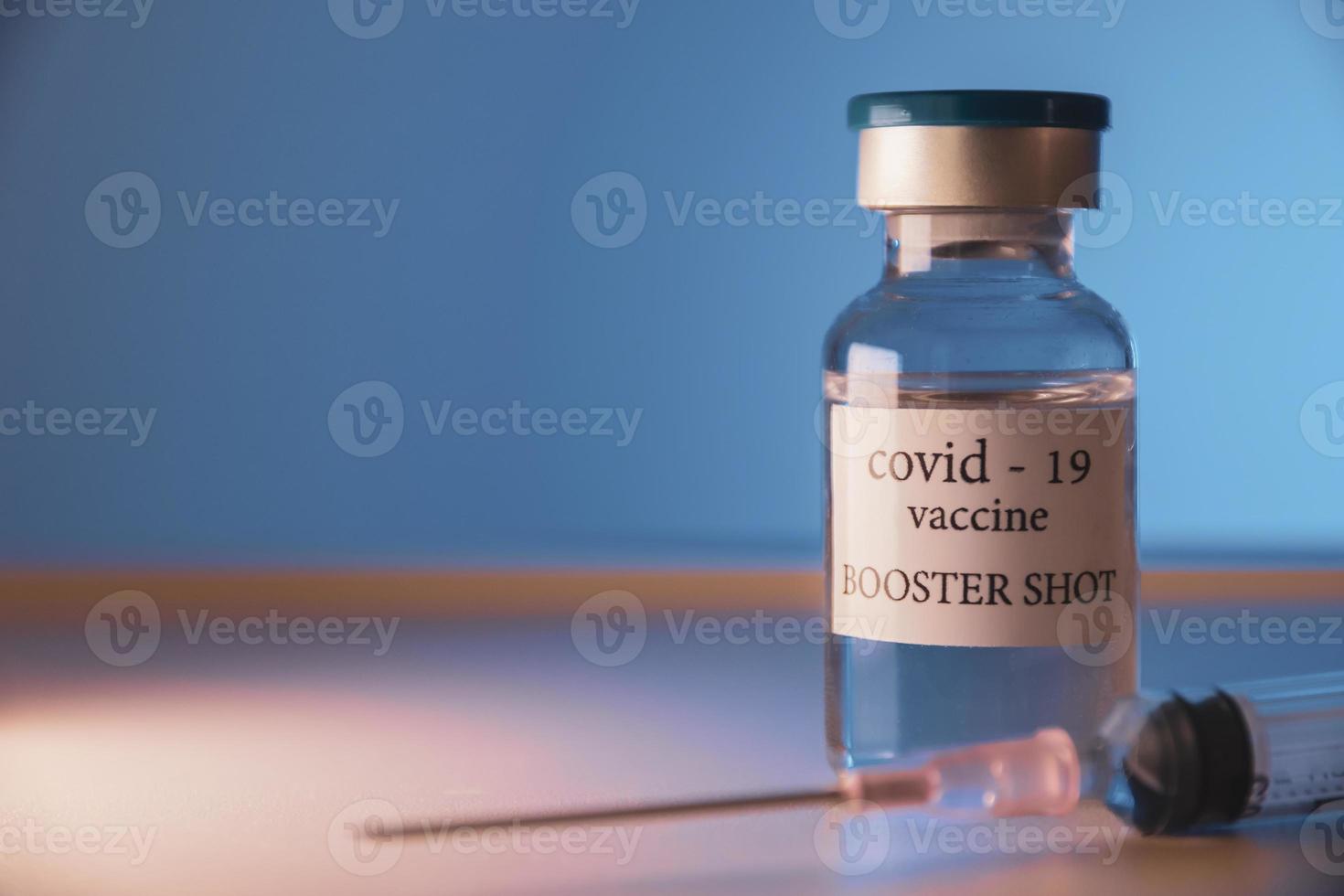 COVID-19 booster vaccine vial. Medicine and health care concept photo