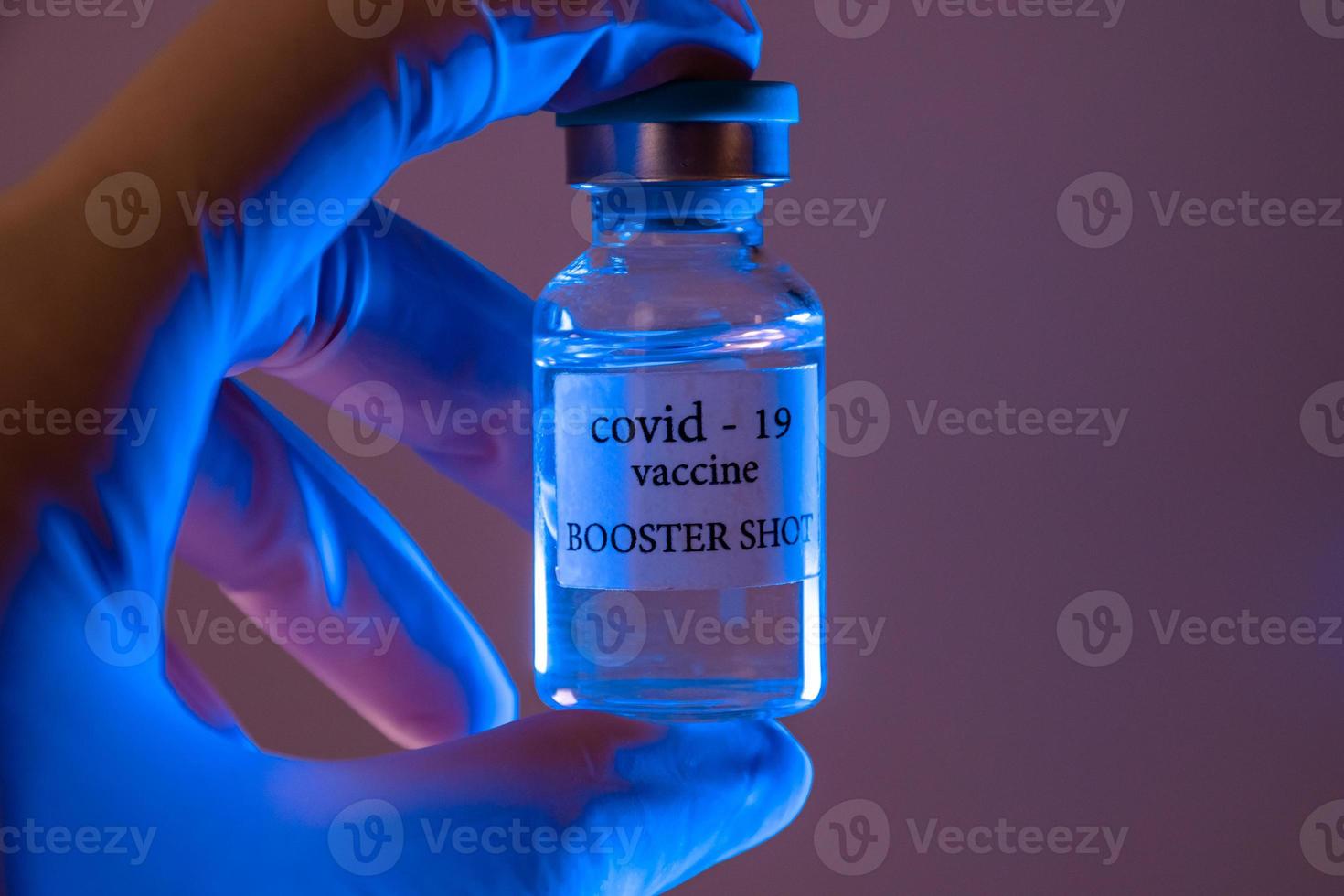 COVID-19 booster vaccine vial. Medicine and health care concept photo