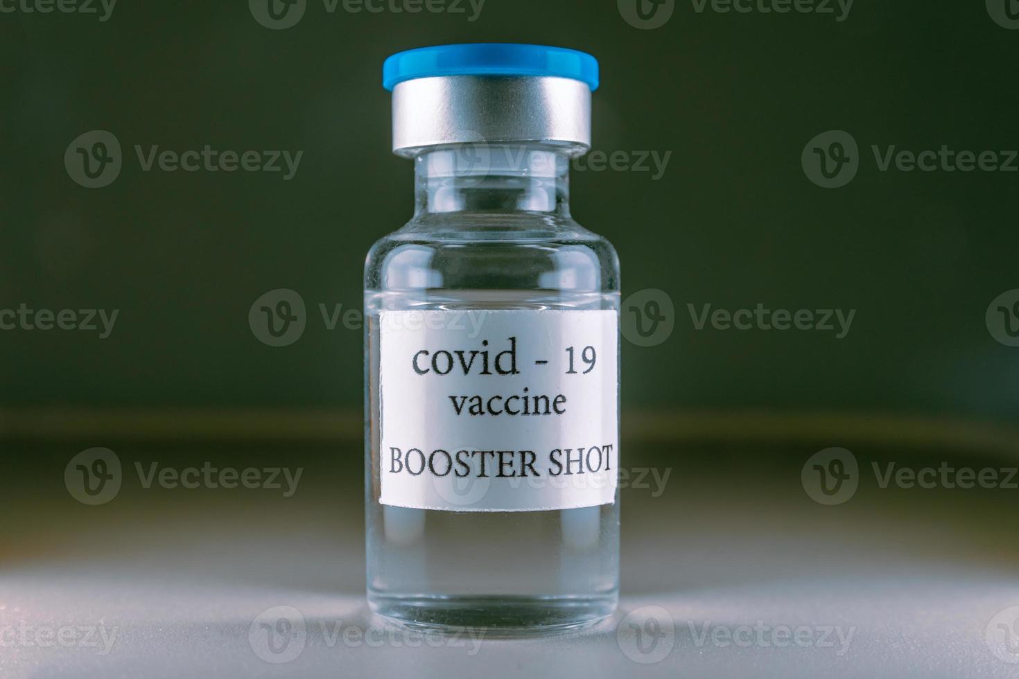 COVID-19 booster vaccine vial. Medicine and health care concept photo