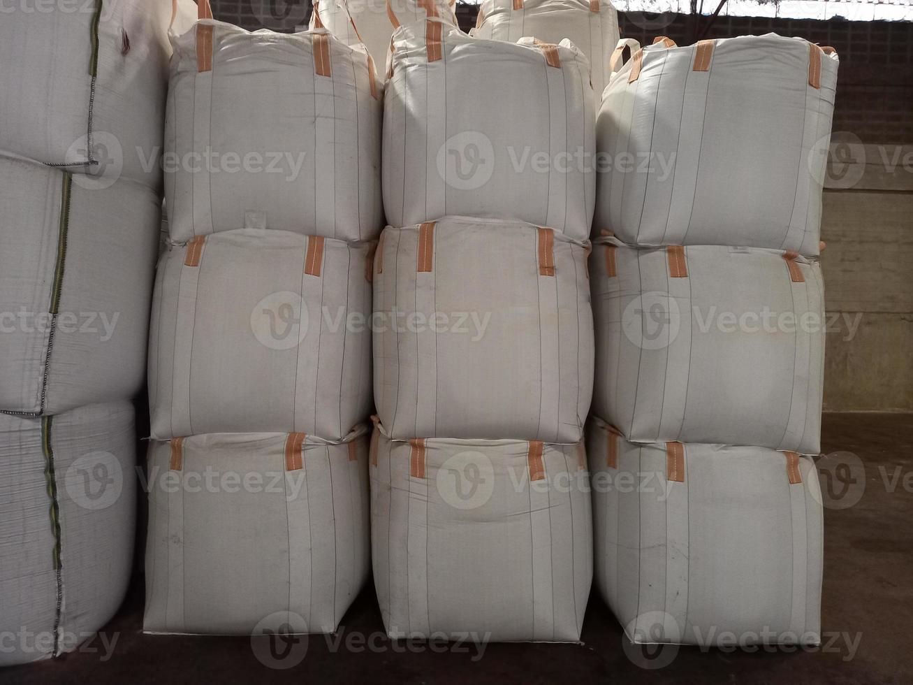 Chemical fertilizer Urea Stock pile jumbo-bag in a warehouse waiting for shipment. photo