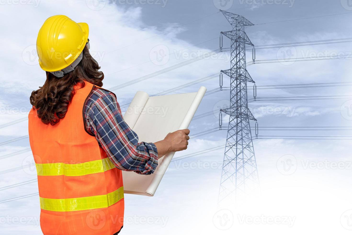 Asian engineer woman standing to planning work at high voltage power station. photo