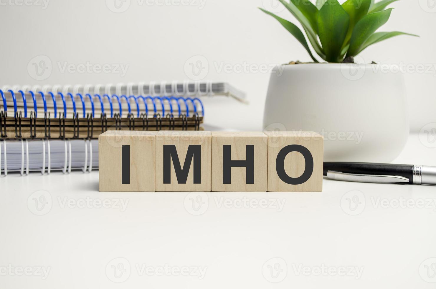 IMO, acronym for In My Opinion, in wooden alphabet letters isolated photo