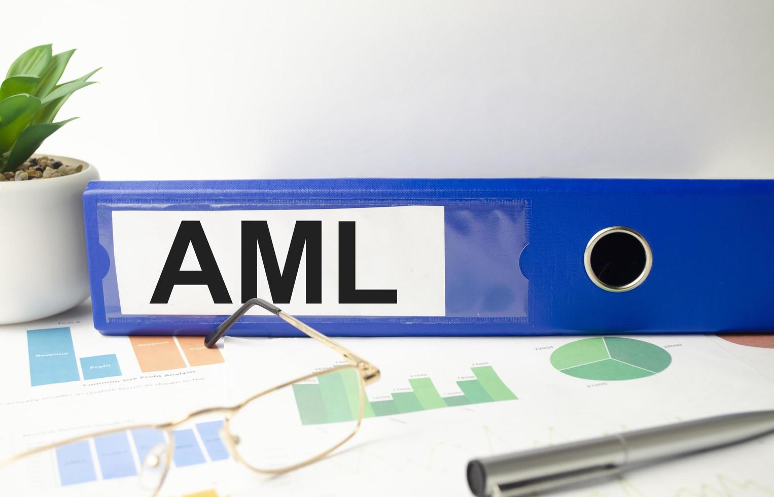 blue file folder with words take AML Anti-Money Laundering . Business concept photo