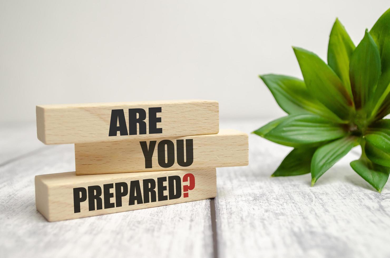 On a light background, wooden cubes and a wooden block with the text Are You Prepared Question photo