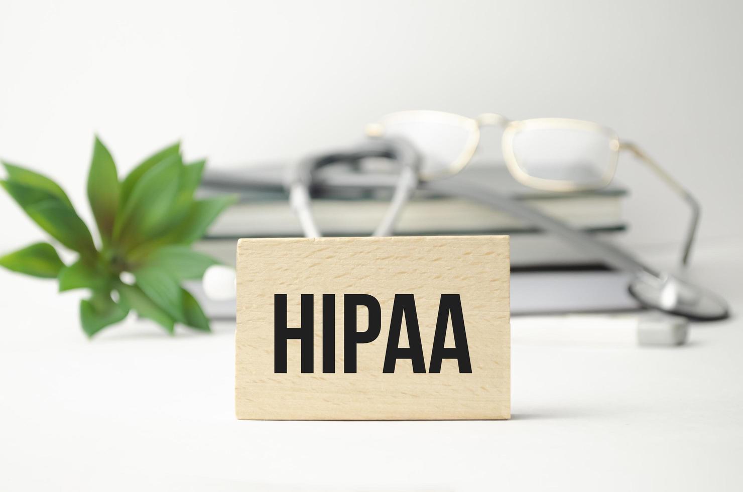 Page with HIPAA The Health Insurance Portability and Accountability Act of 1996 on the table with stethoscope, medical concept photo
