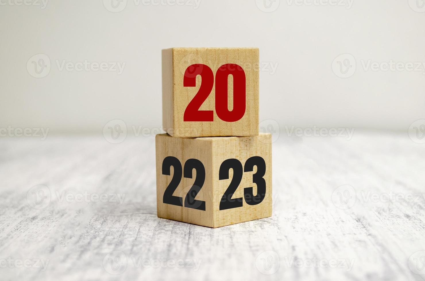 Wooden block cube flipping between 2022 to 2023 for change and preparation merry Christmas and happy new year. photo