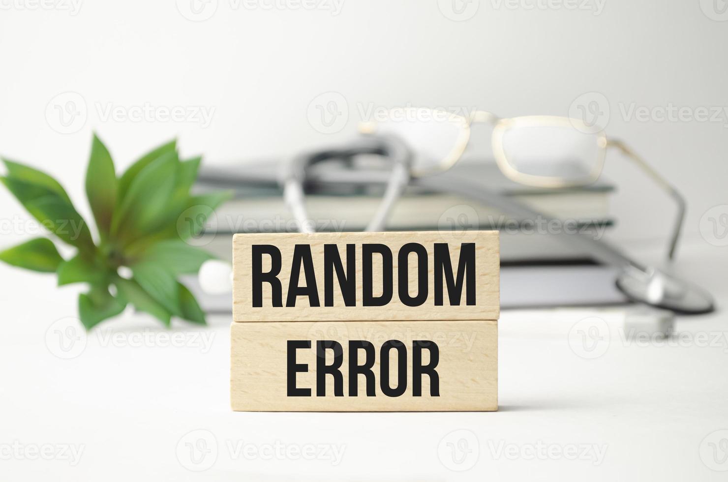 RANDOM ERROR word on wooden block and stethoscope photo