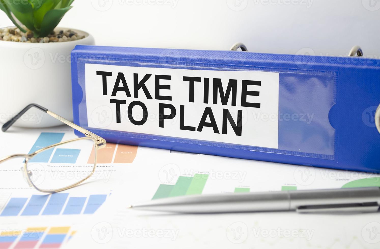 blue file folder with words take time to plan . Business concept photo