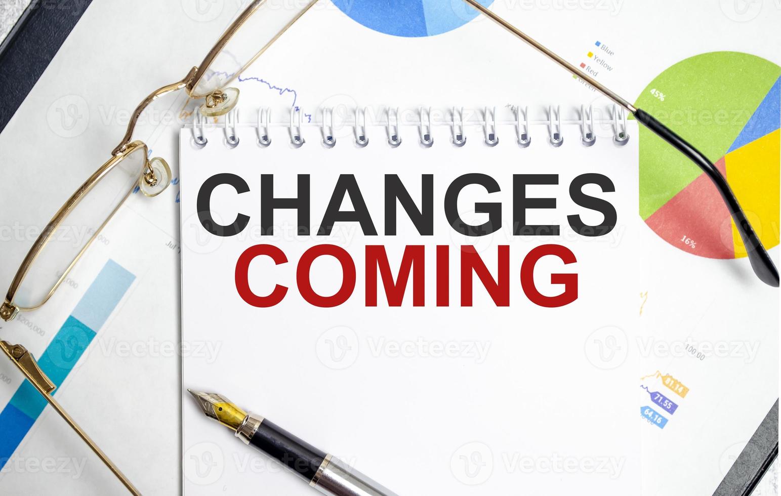 Notebook with Tools and Notes with text change is coming photo