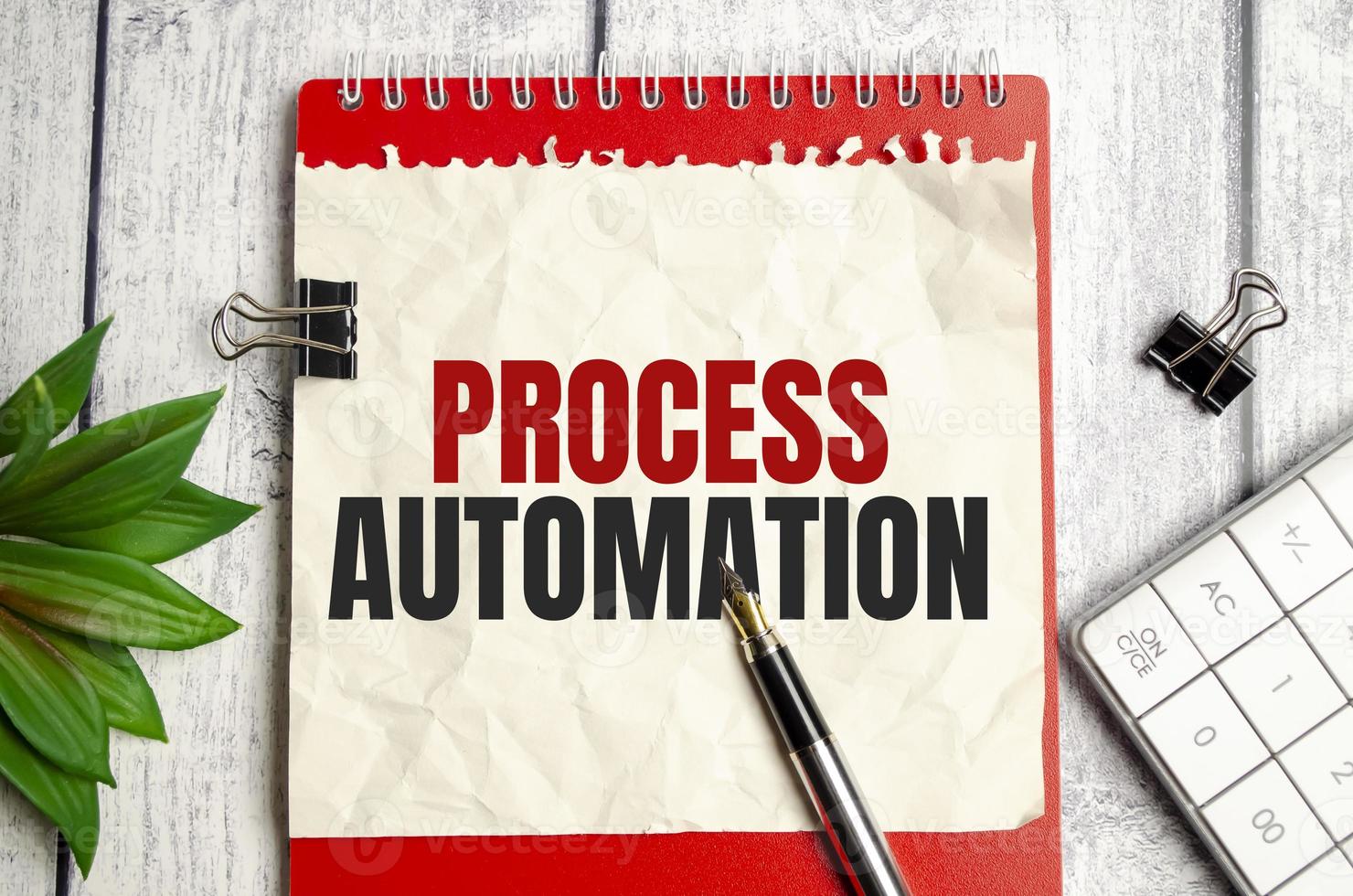 Text PROCESS AUTOMATION on Office desk on wooden background photo