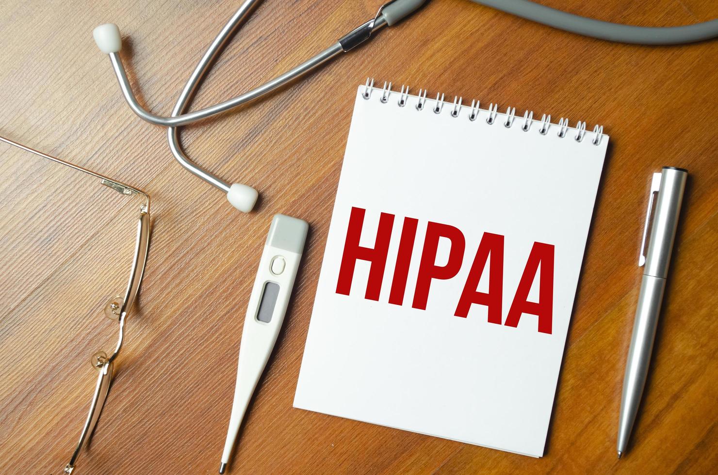 Page with HIPAA The Health Insurance Portability and Accountability Act of 1996 on the table with stethoscope, medical concept photo