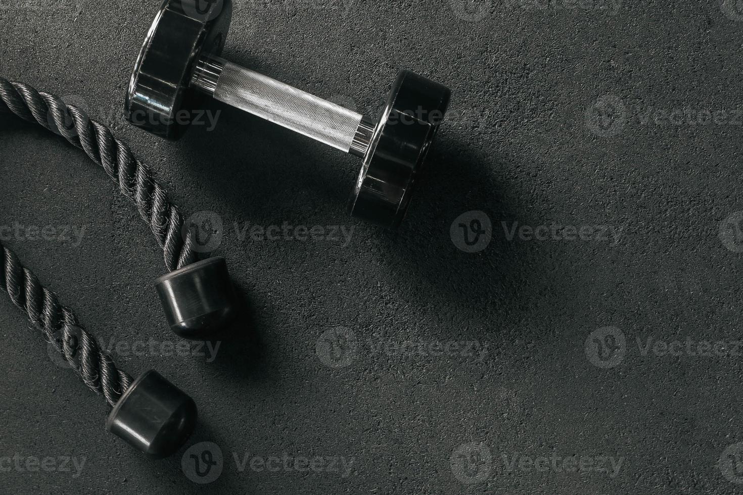 Gym equipment on floor in Gym. fitness equipment with with empty space. Fitness concept background. photo