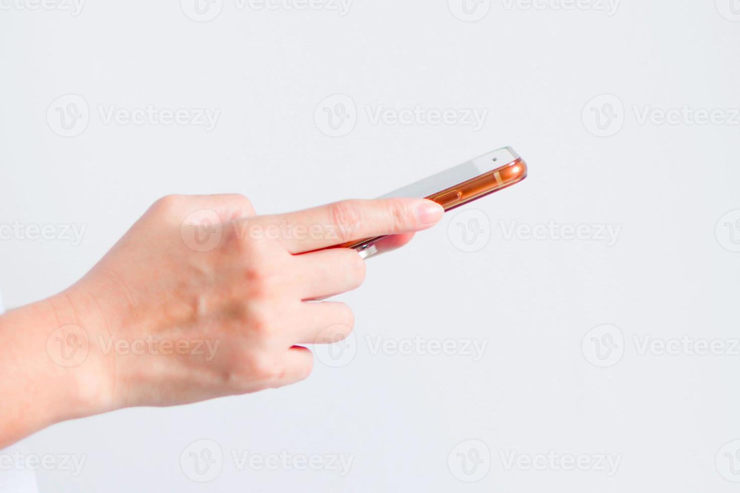 A hand of woman holding mobile phone for connecting to social media. photo