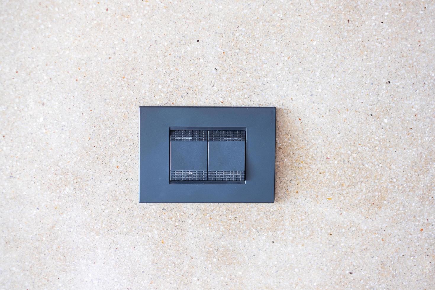 finger turn on or off on light switch on wall at home. Energy Saving, power, electrical and lifestyle concepts photo