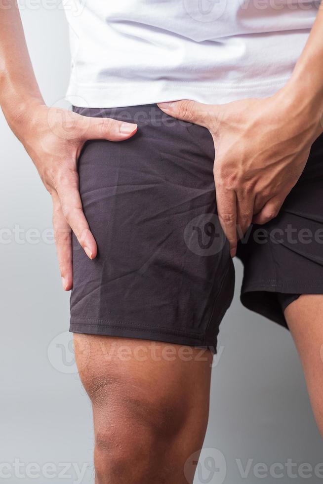 adult male with muscle pain during running. runner have leg ache due to Groin Pull, liotibial Band Syndrome  or prostate cancer. Sports injuries and medical concept photo