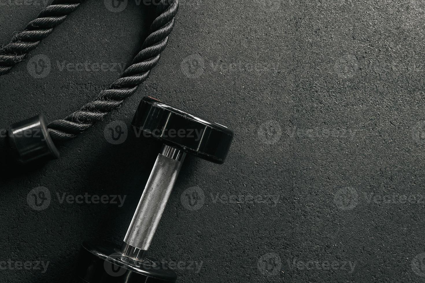 Gym equipment on floor in Gym. fitness equipment with with empty space. Fitness concept background. photo