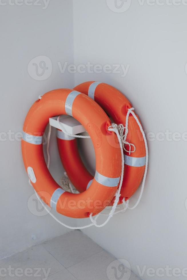 Lifebuoy at swimming pool. red lifebuoy for safety life. photo