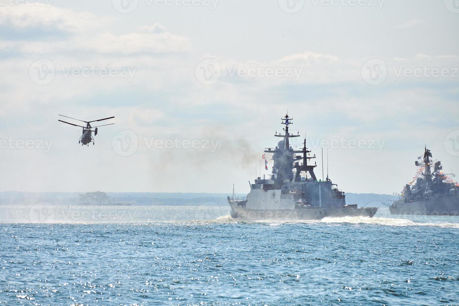 Battleships war ships corvette during naval exercises and helicopter maneuvering over sea, warships photo