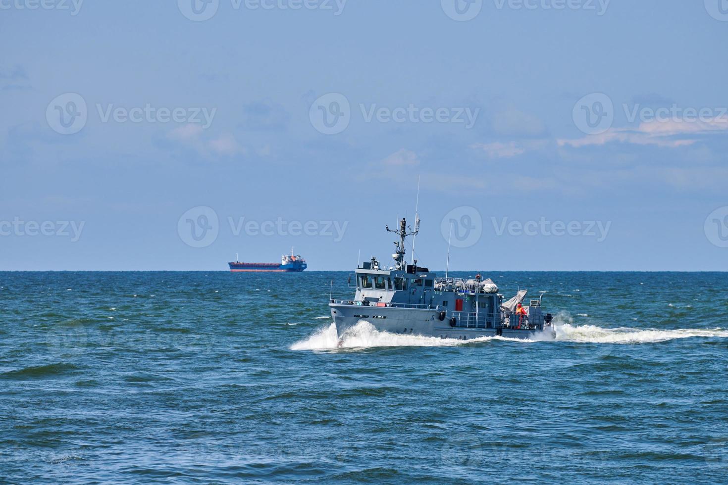 Coastguard, rescue support patrol boat for defense, military ship on high blue seas, Russian Navy photo