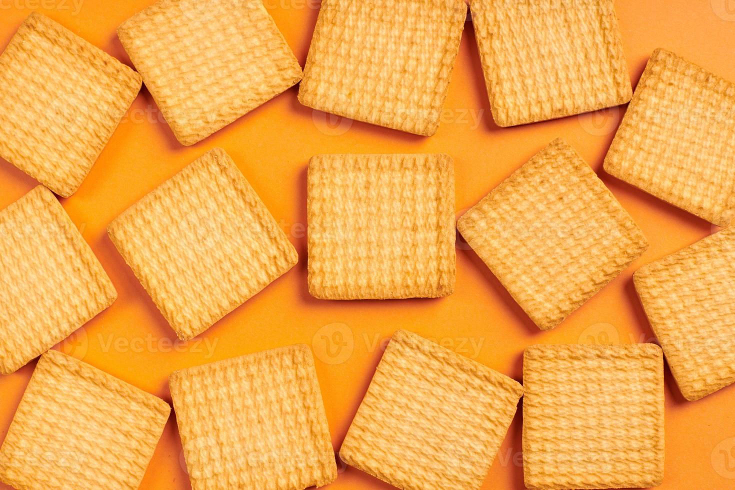Cookies on orange background. photo