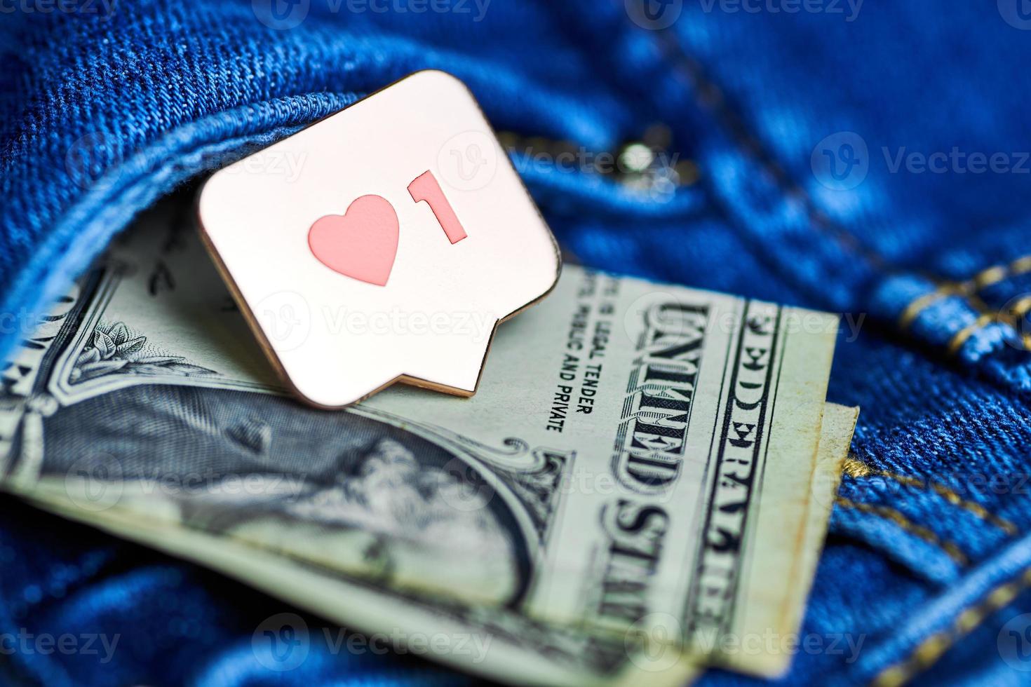 Like heart symbol and dollar in jeans pocket photo