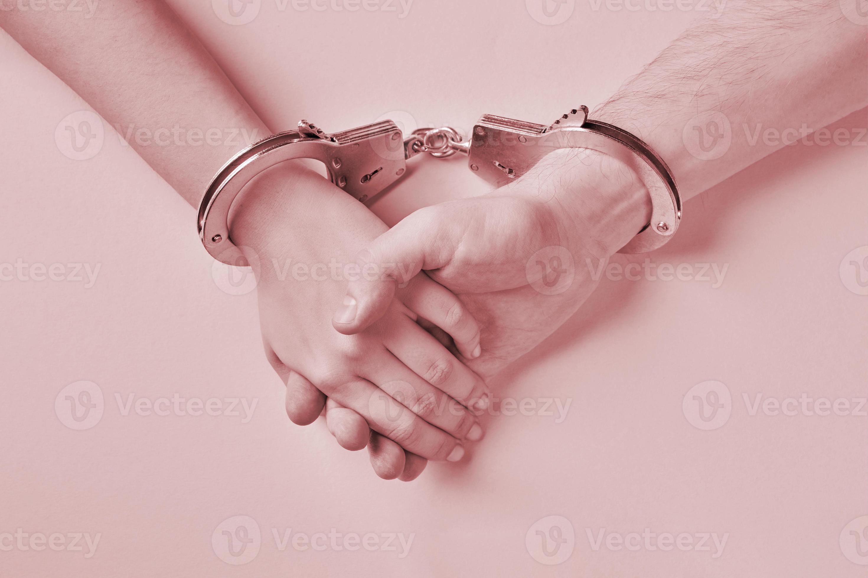 Male and female hands in handcuffs. Love forever. 9183311 Stock Photo