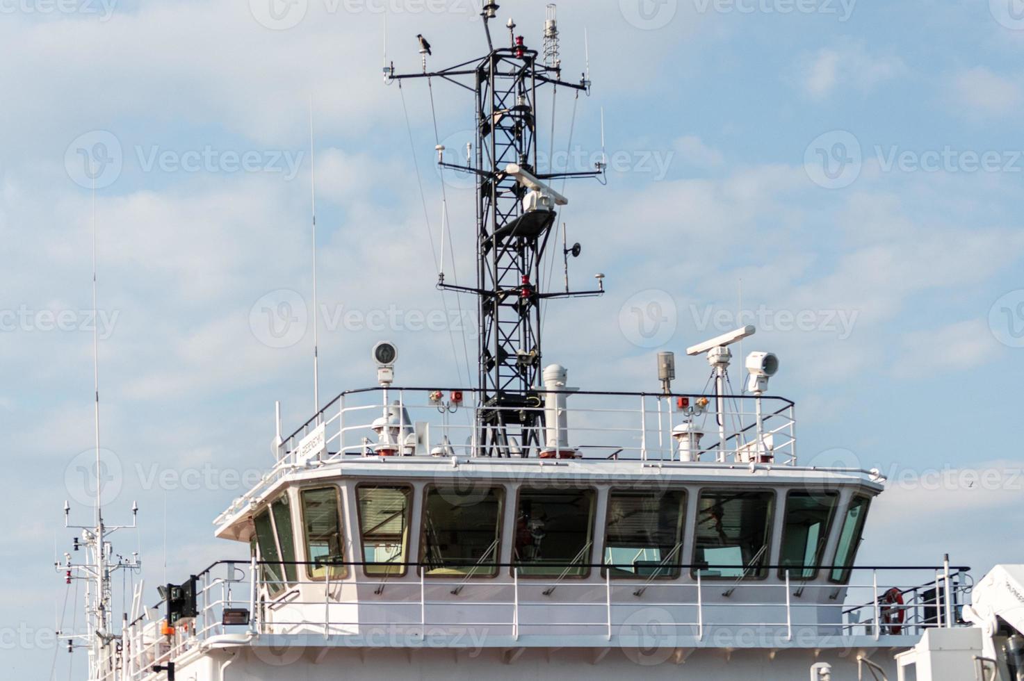 Ship bridge for navigation and control. Cargo ship waiting for a captain and crew. Vessel is ready to shove off and start new voyage. photo