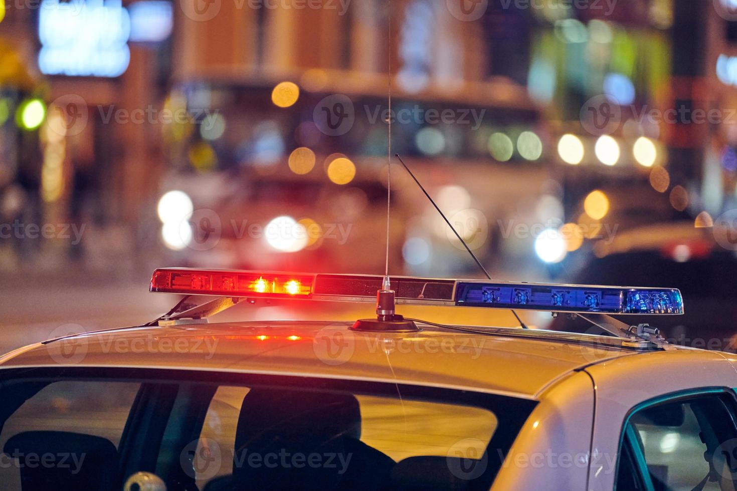 Police car lights at night city street photo