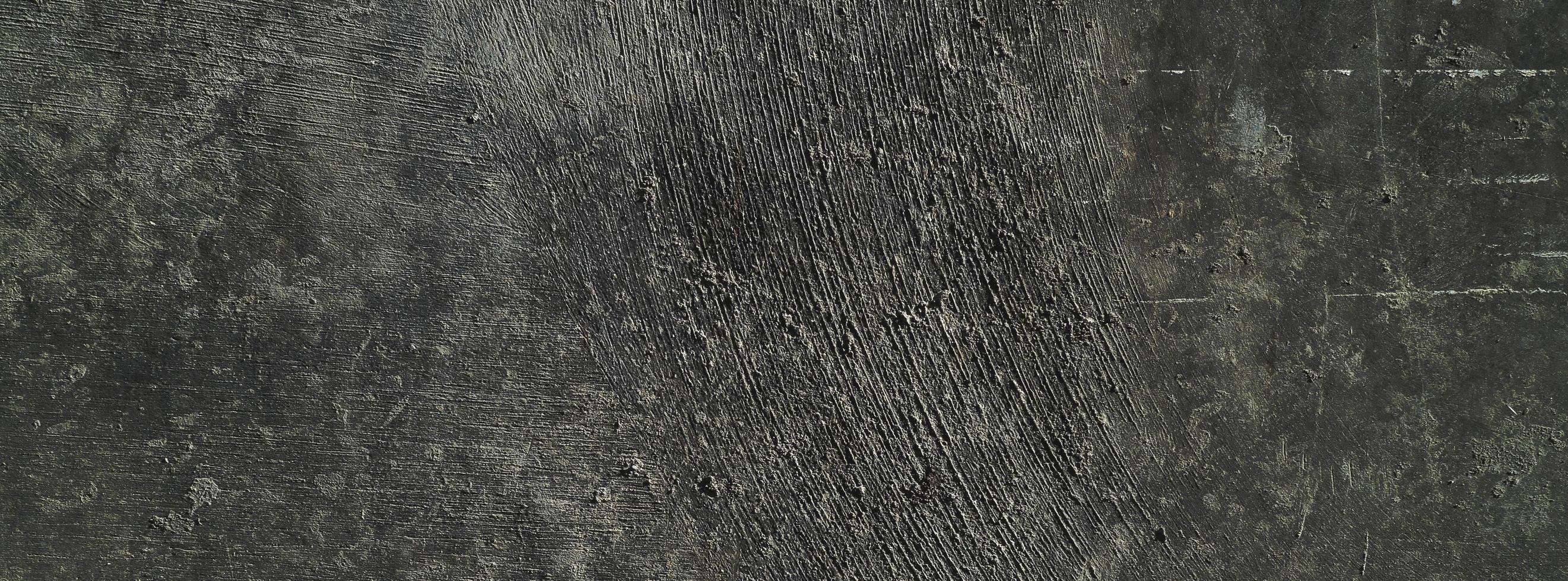 Black wall background.concrete wall plastered dark scratch background.grunge texture. photo