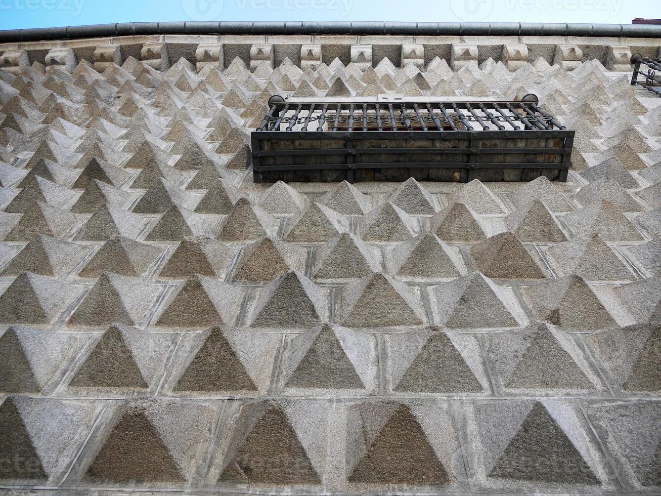 Geometric 3d pyramid shape wall facade design of a building in Segovia, with iron steel and wooden balcony photo