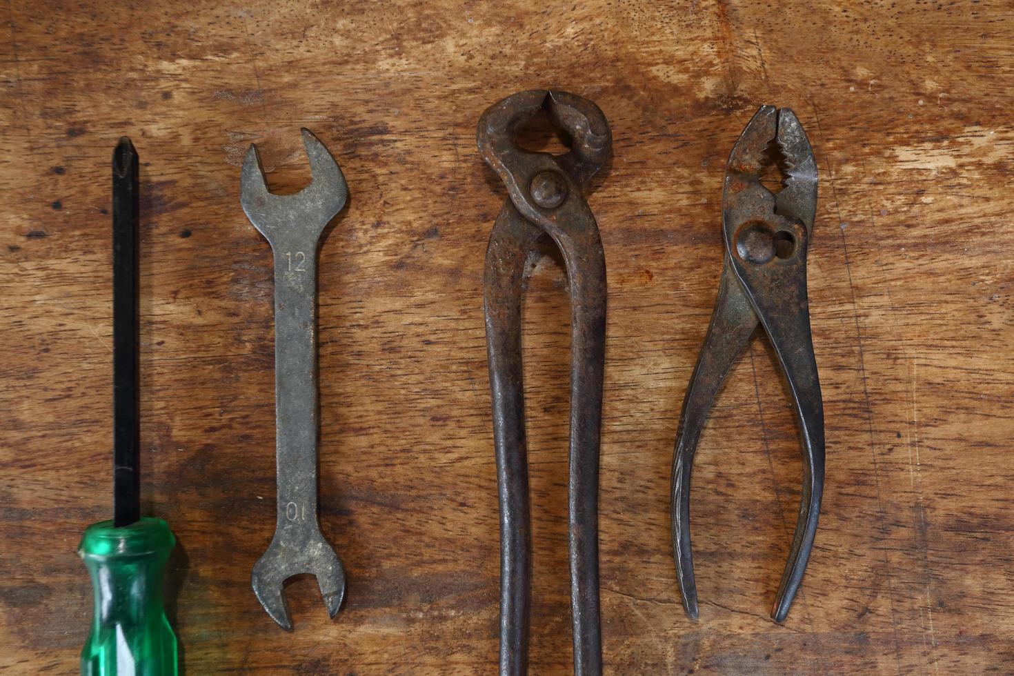 Old tools on a wooden table photo