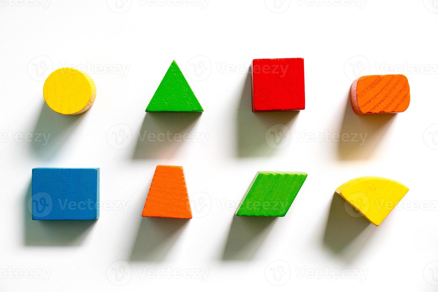 Set of colorful wooden shape toy on white background photo