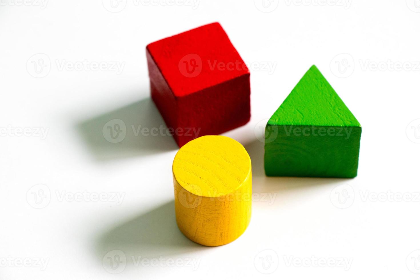 Set of colorful wooden shape toy on white background photo