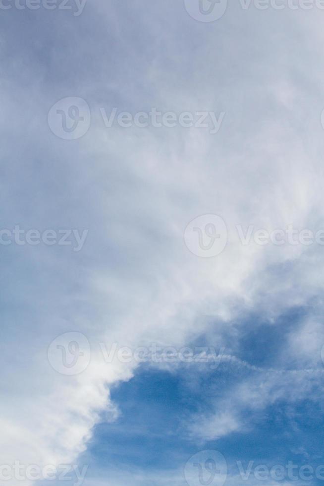 Beautiful blue sky with dynamic white clouds photo