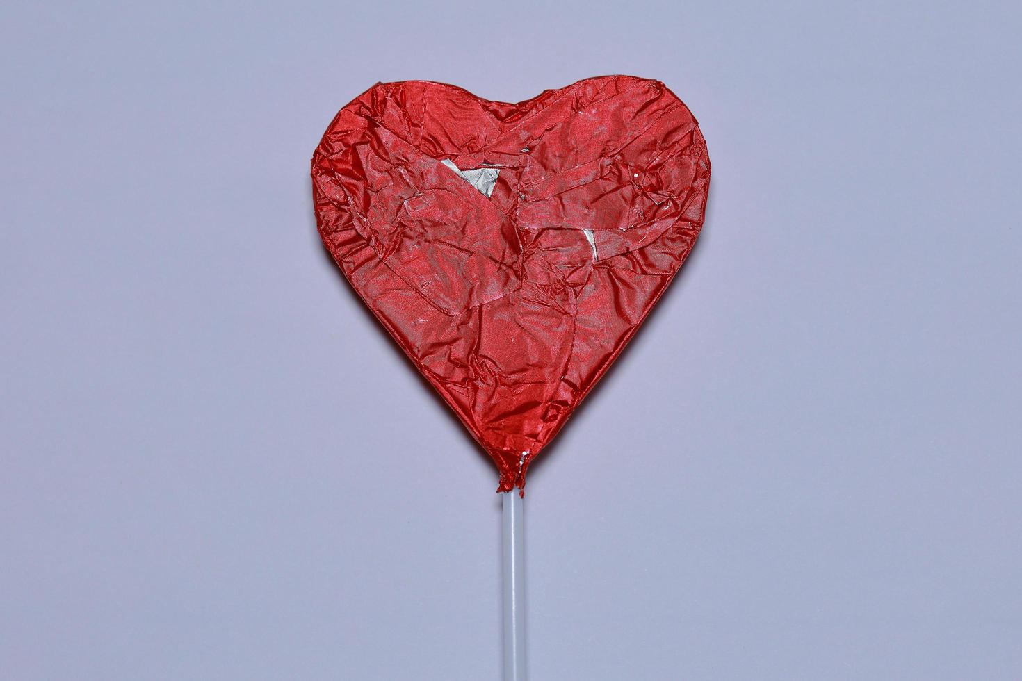 Chocolate heart on a white background. photo