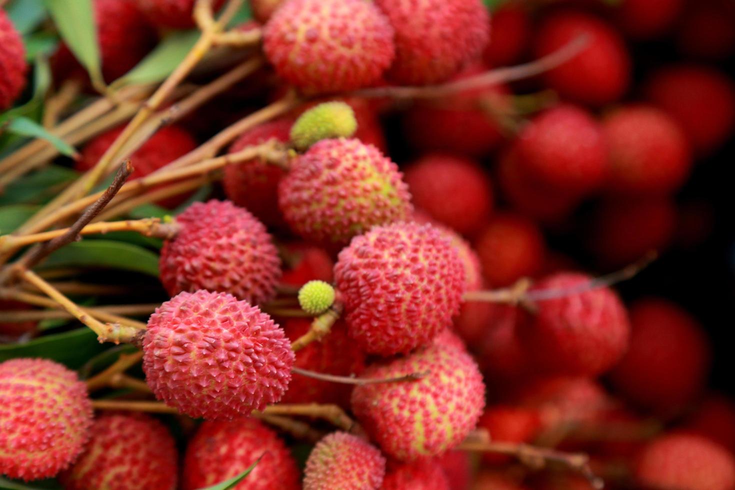 Lychees Fresh fruit a lot of them are sold for sale in the market. photo