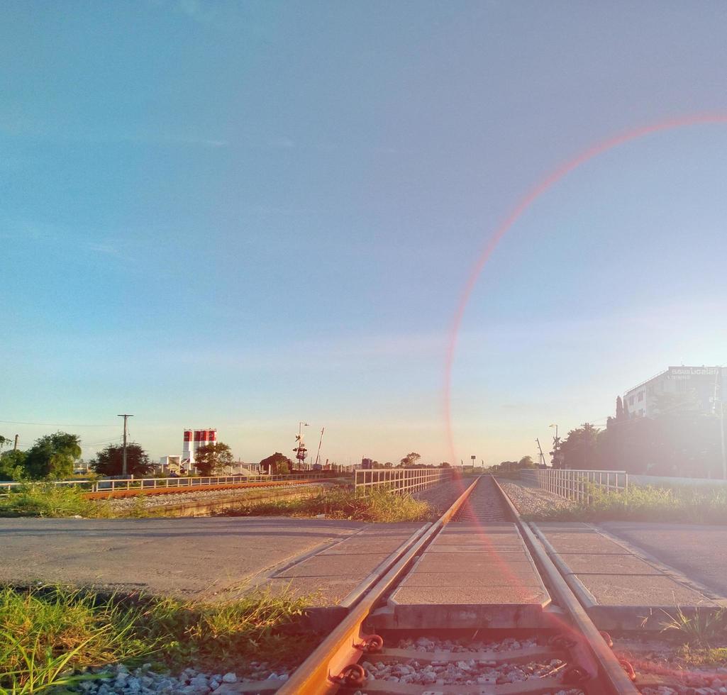 landscape rail transport bright blue sky  The sun shines in the evening, giving the concept of transportation, traveling, feeling far and fast. photo