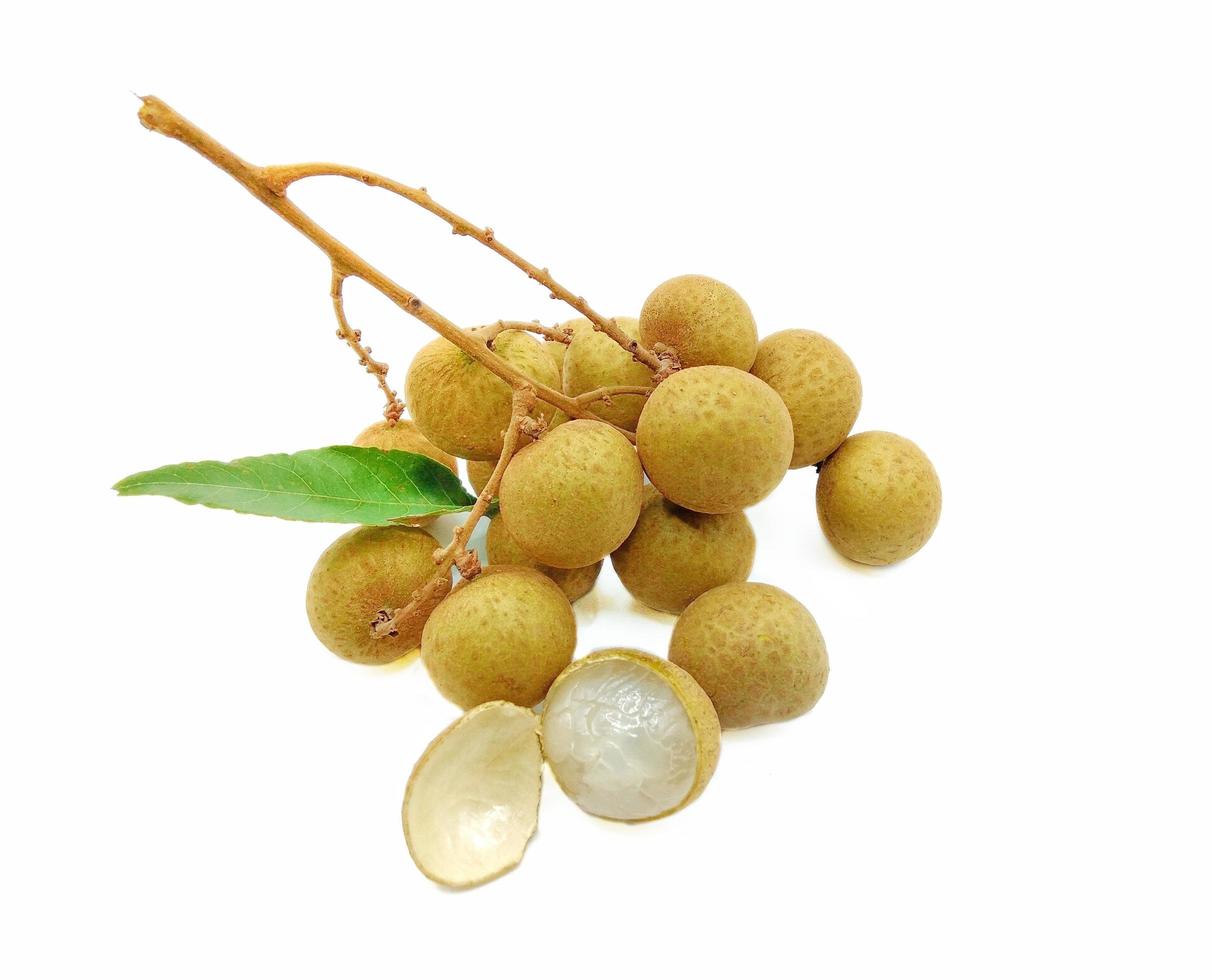 A bunch of yellow longans on a white background.  It is a Thai fruit that is sweet, juicy and nutritious. photo