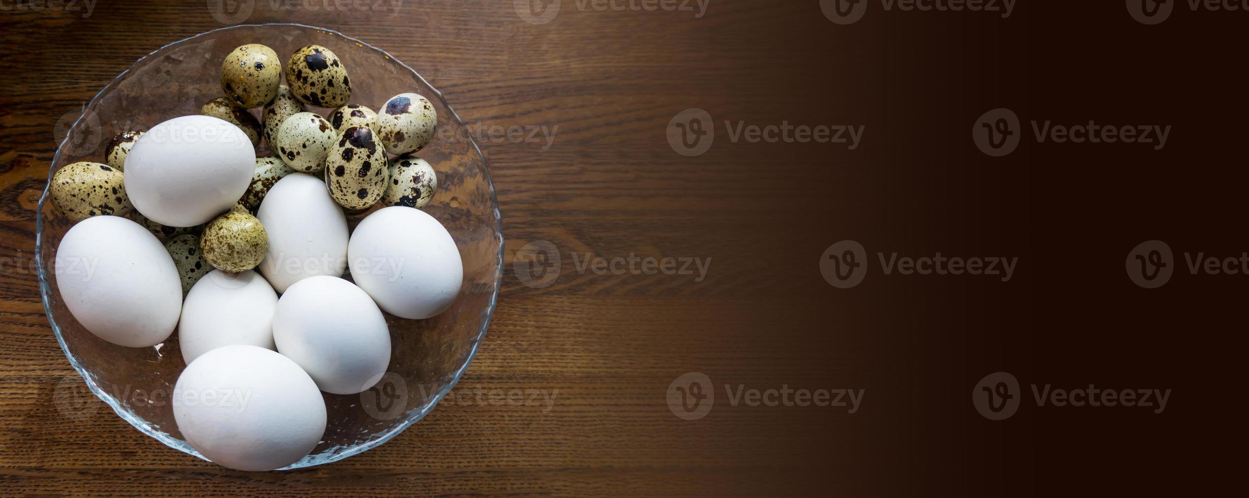Different eggs background. Quail eggs on white dish, There are many sizes and patterns are different. photo