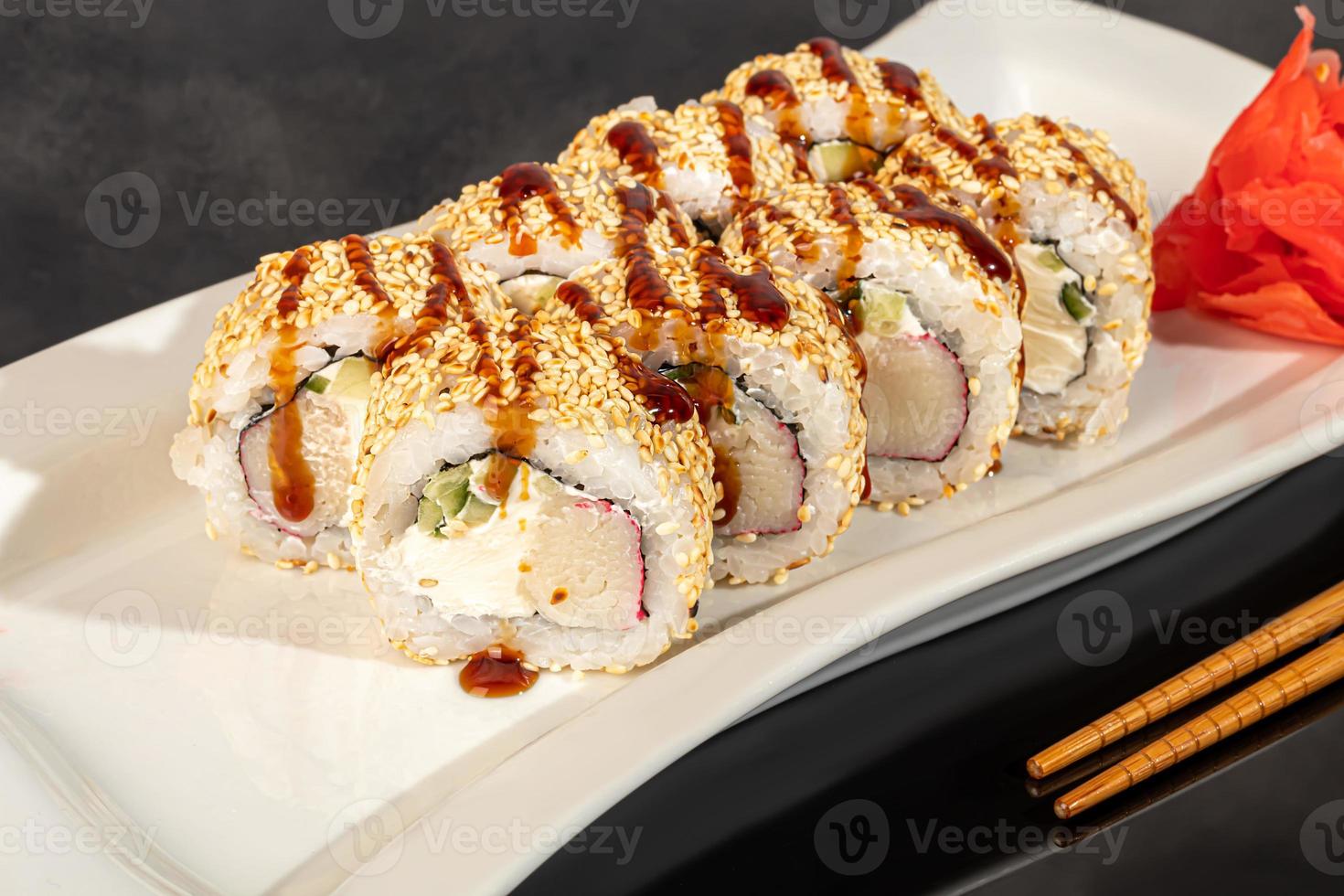 Sushi sets Uramaki, California, Philadelphia, rolls on a white plate. Menu for restaurants, cafes. On a dark reflective background. photo