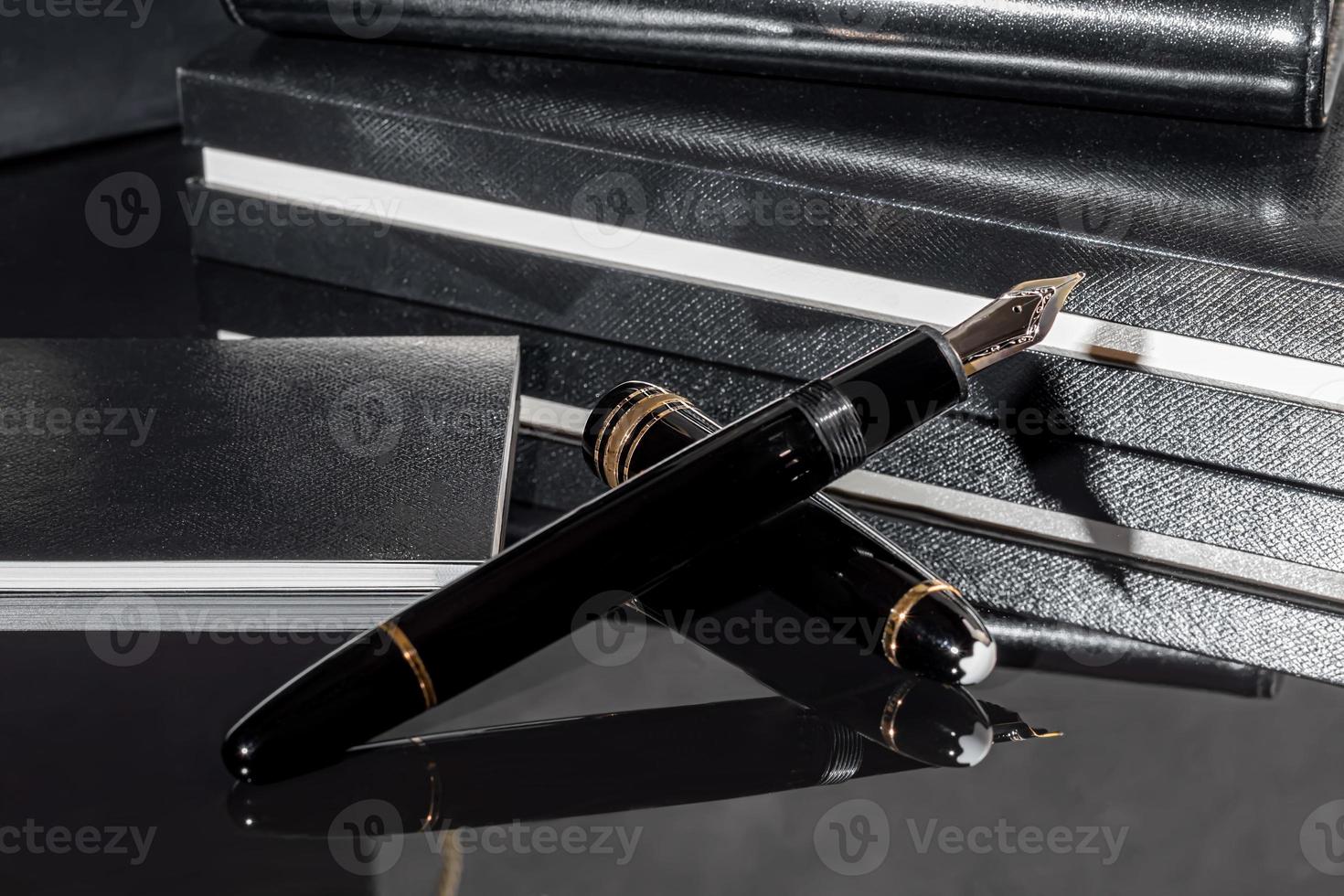 Fountain pen on a marble and gray background. Selective focus. photo