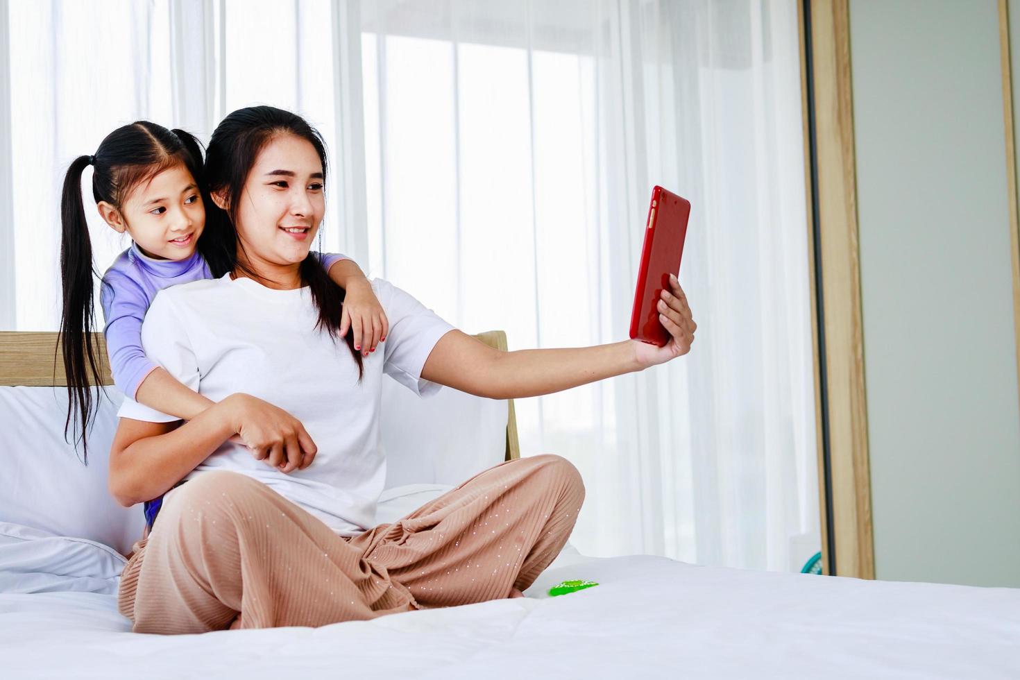 Video Call Family Selfie. Portrait Mother and Kids Kissing on Camera. photo