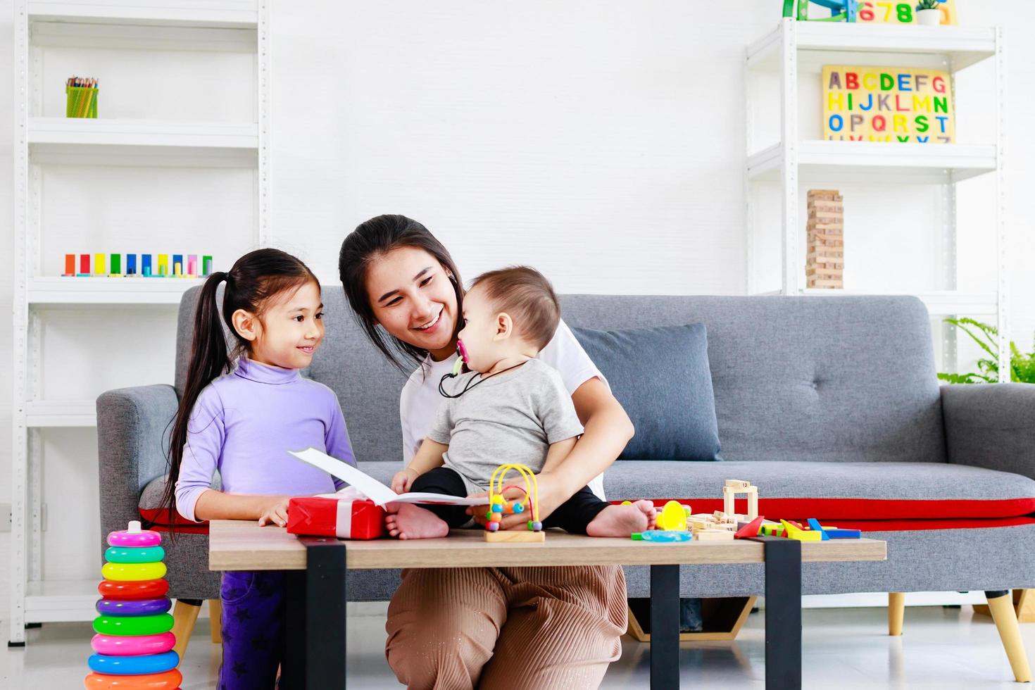 Happy family and Mother's day concept, daughter, mom, and baby enjoy together. photo