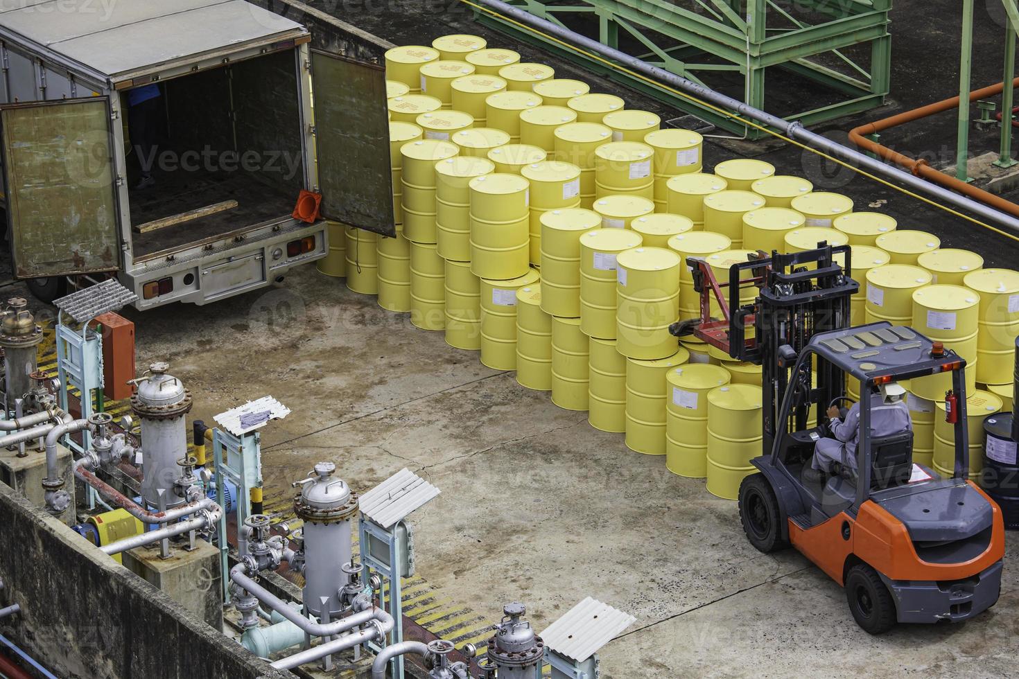 Top view oil barrels forklift truck move for the transportation truck. photo