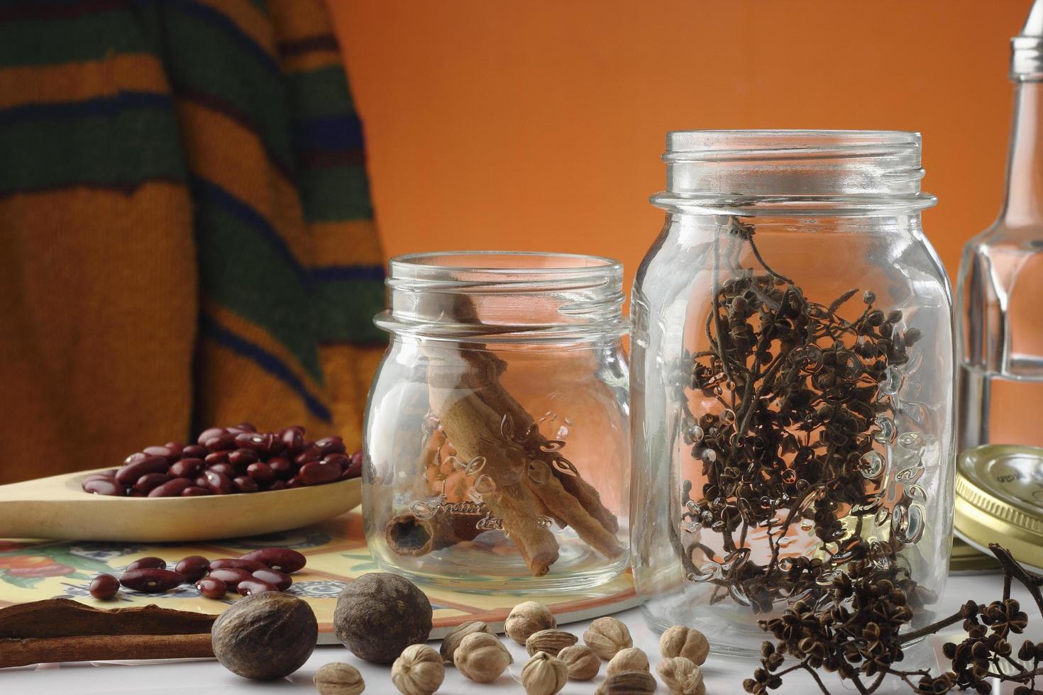 spices jars on table kitchen photo