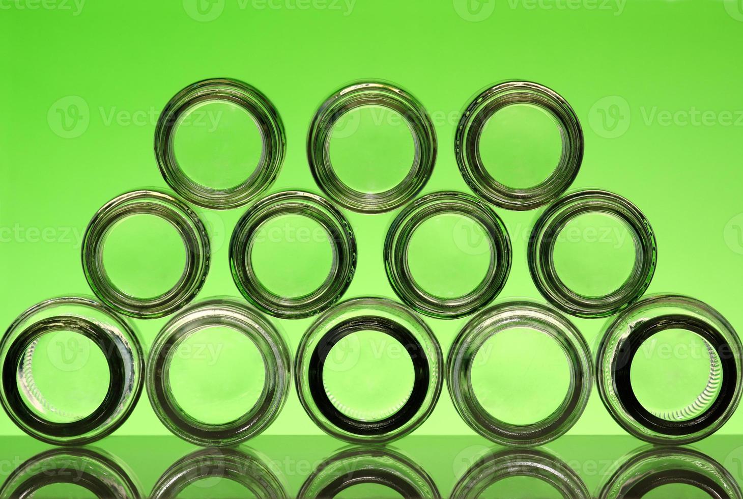 group of clear bottle with green background. photo