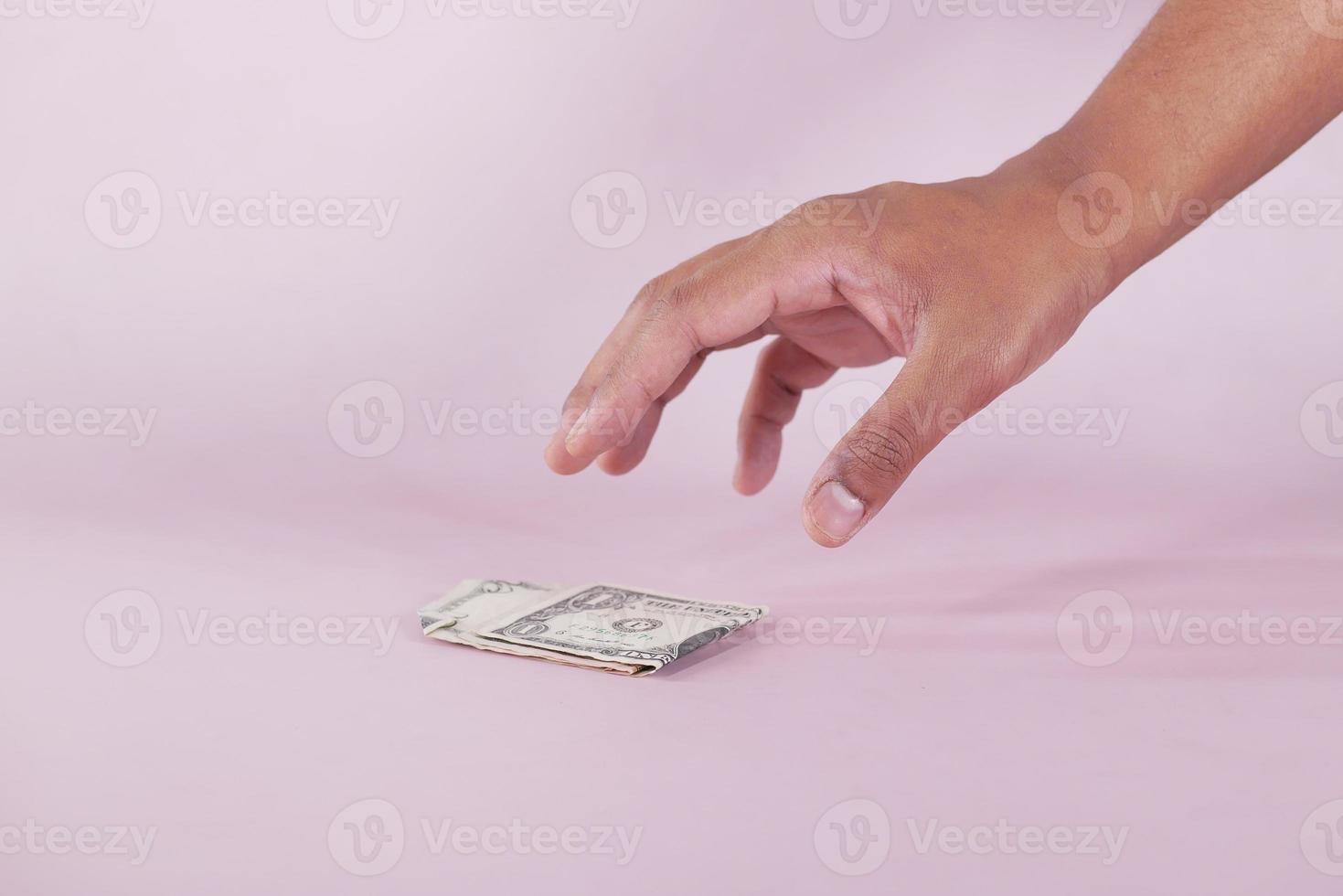 hand pick a one dollar cash 9208014 Stock Photo at Vecteezy