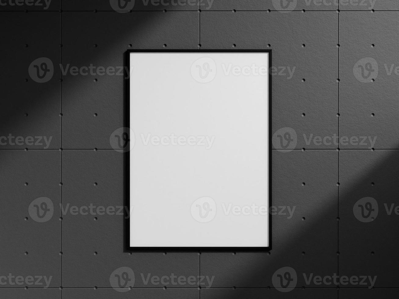 Clean and minimalist front view portrait black photo or poster frame mockup hanging on the industrial brick wall with shadow. 3d rendering.