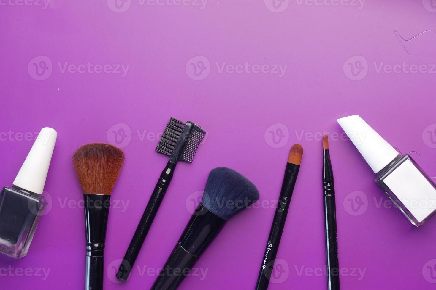 top view of decorative black color cosmetic on dark background photo