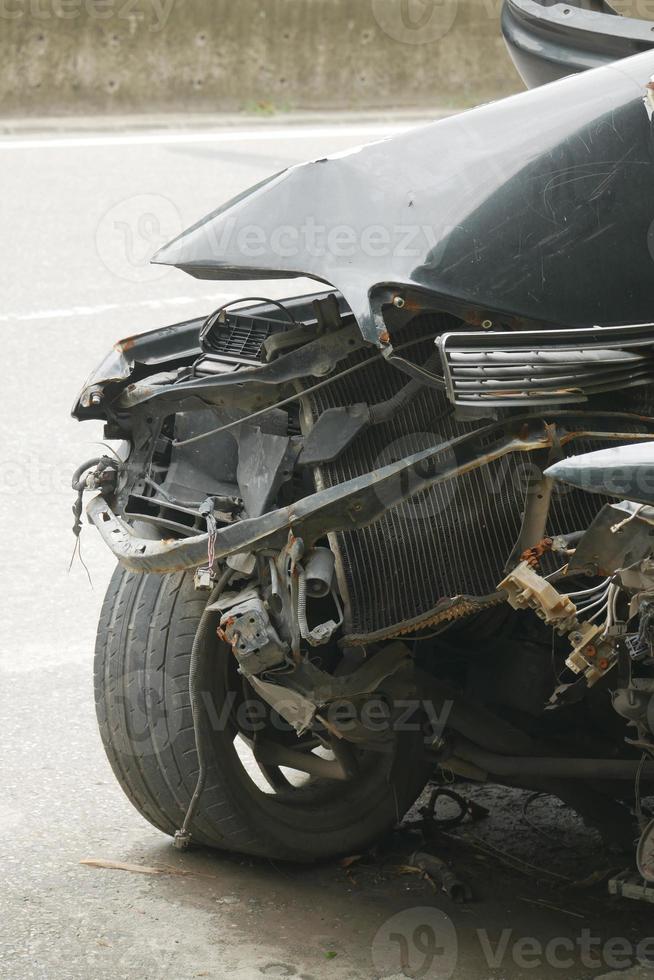 black car damaged by a road accident photo